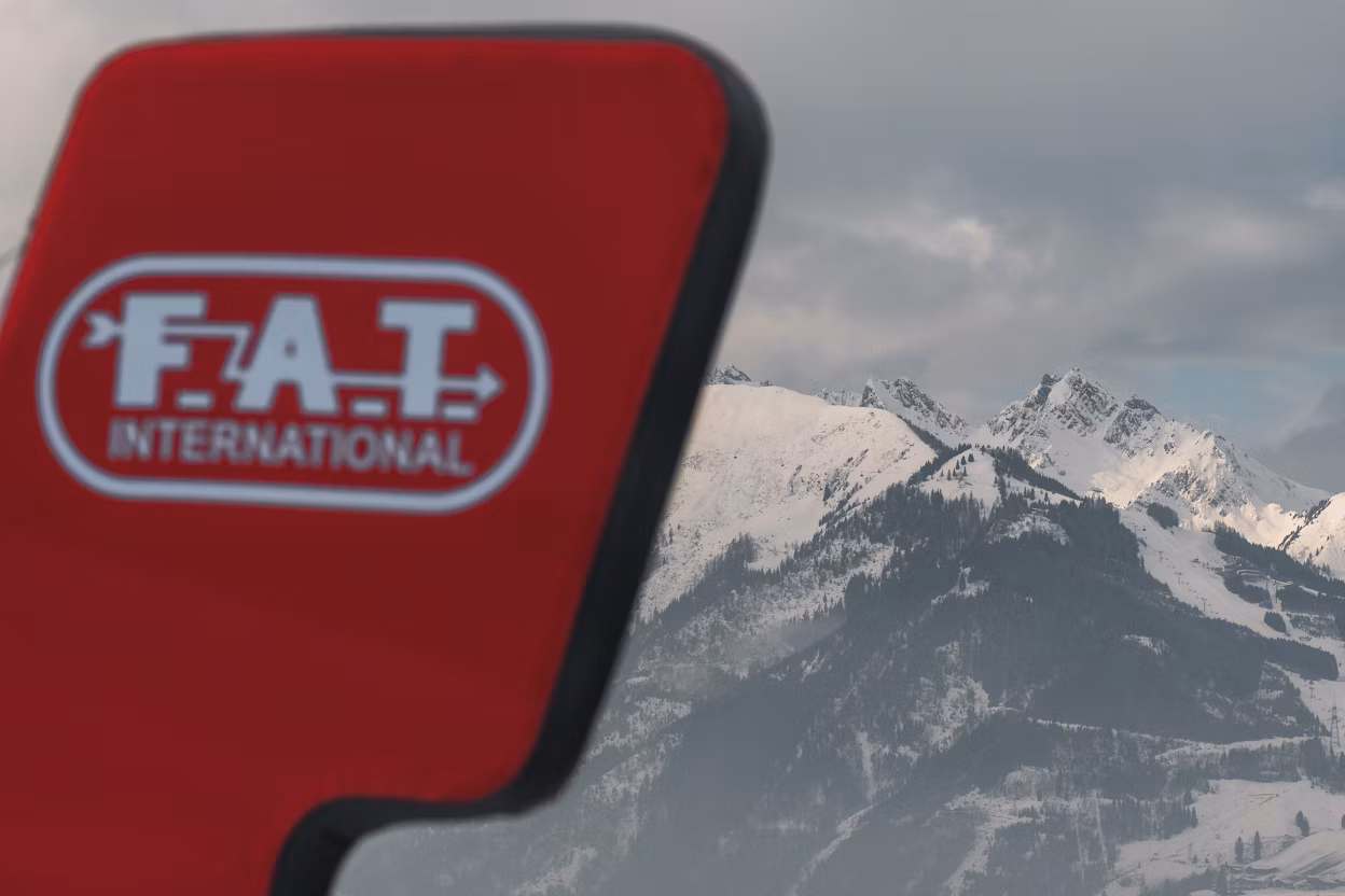 FAT ice logo in front of mountain range