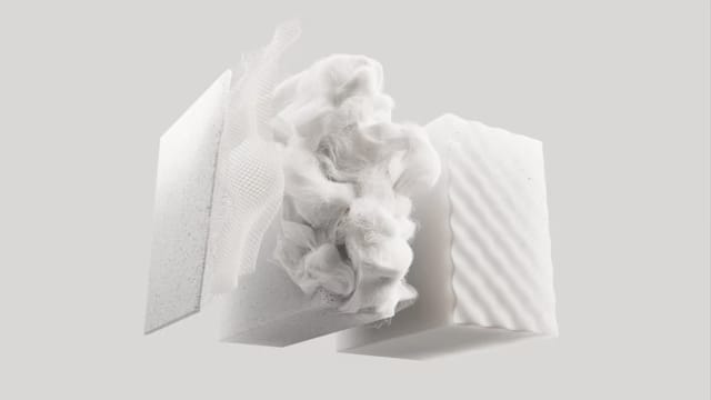 A floating render of white, plush upholstery materials used for Polestar 6’s seats.